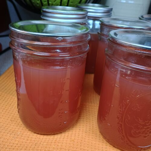 homemade canned red grape jelly in mason jars